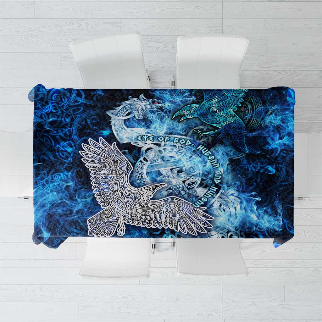 Blue Viking-style tablecloth with white raven and ornate eye motif, flowing pattern.