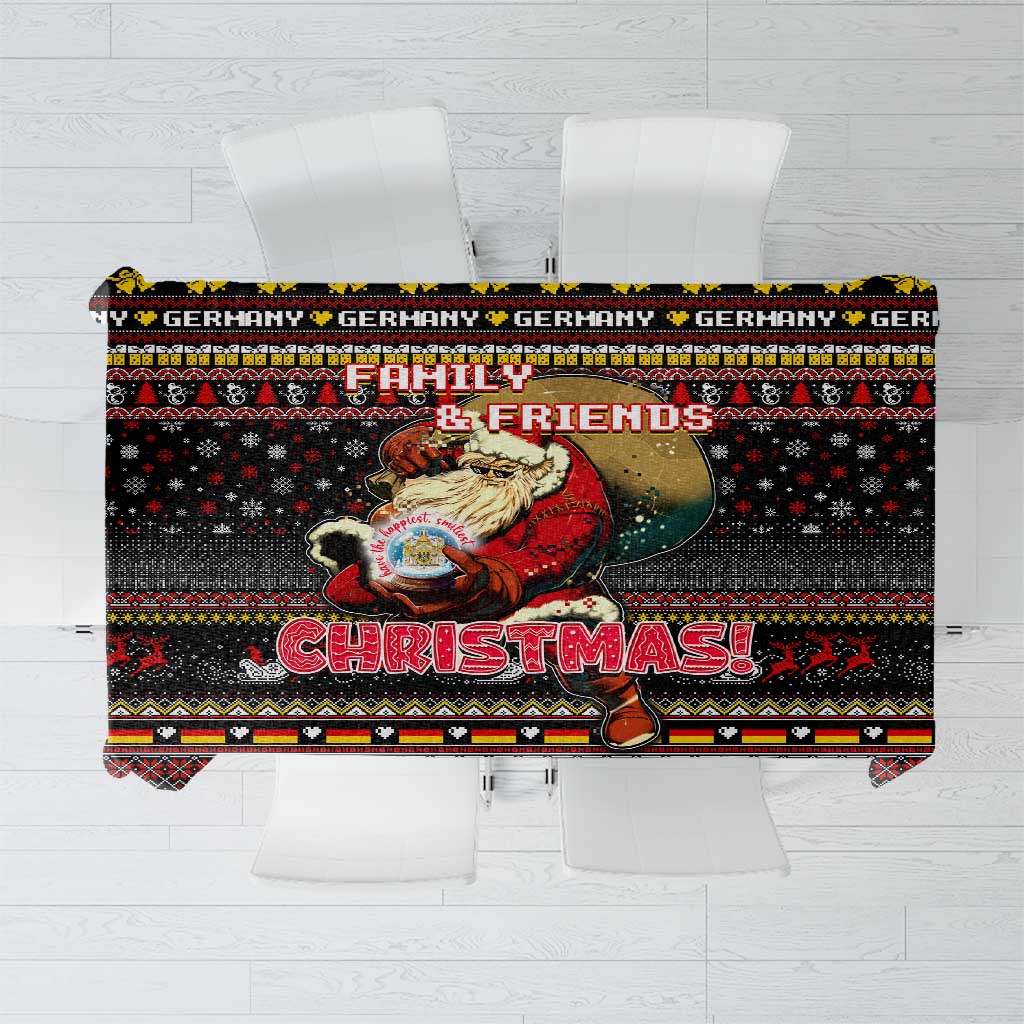Black Christmas tablecloth with multicolor geometric pattern and festive “Christmas” text
