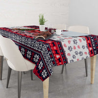 Christmas dog tablecloth corner detail, white with red/black patterns and paw print motif