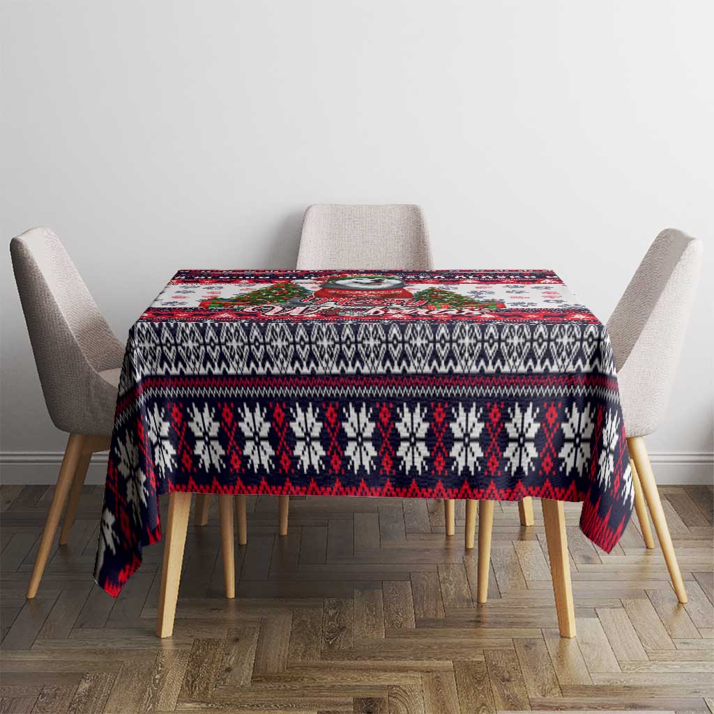 Christmas dog tablecloth laid across dining set, white with red/black geometric stripe pattern