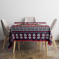 Christmas dog tablecloth laid across dining set, white with red/black geometric stripe pattern