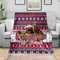 Christmas dog art blanket, red and navy with white paw prints and “Merry Woofmas”