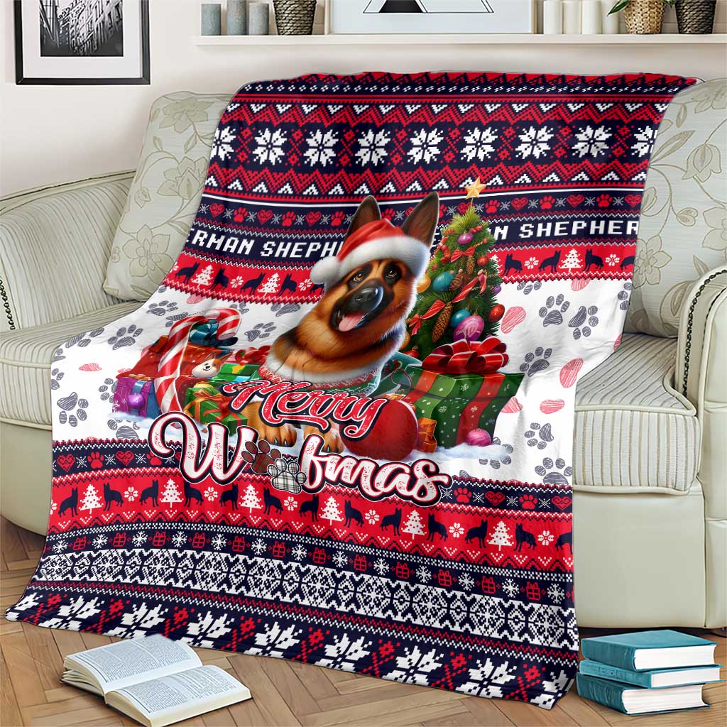 Red, navy and white dog art Christmas blanket draped on a sofa with “Merry Woofmas”