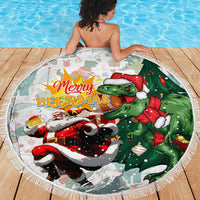Round beach blanket with Merry Beermas T-Rex Santa graphic, circular fringe