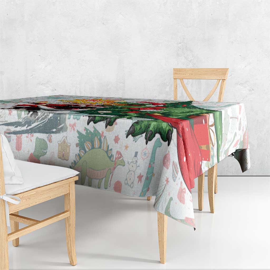 White T-Rex Christmas tablecloth draped over bench, dinosaur and Santa graphic print.