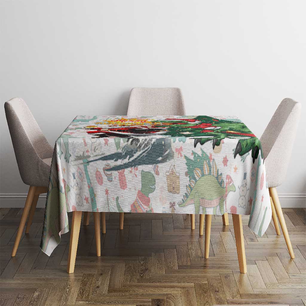 White dinosaur Christmas tablecloth on a small dining table with Merry Beermas artwork.