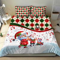 Christmas duvet set on bed with white Santa print, red/green diamond check trim, two pillows