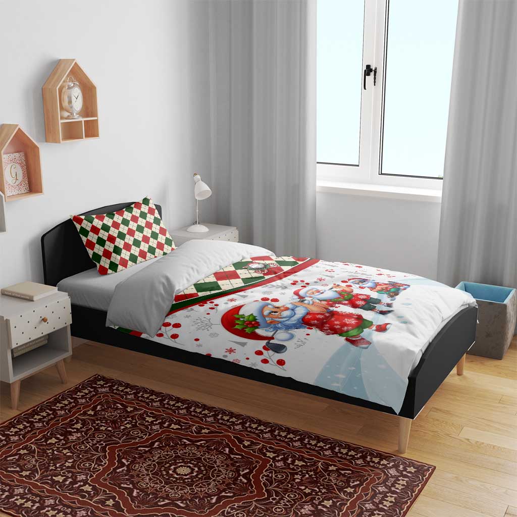 Christmas bedding set on bed: white duvet with Santa scene, red/green check details