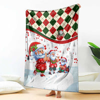 Draped Christmas blanket with red and green diamond plaid top border and Santa scene on white