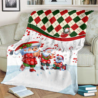 Santa Christmas blanket with white fabric, red-and-green plaid band, Santa figures on sofa