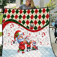 Christmas quilt with blue Santa and gnome figures, red/green diamond border, white backing