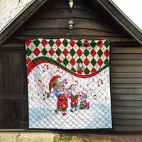 Christmas quilt on porch wall with blue Santa and small gnome figures, diamond plaid border