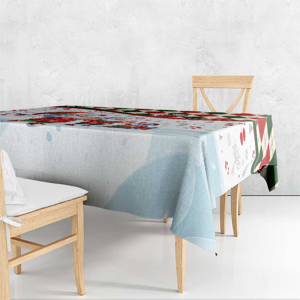 Rectangular Christmas tablecloth draped over benches, light blue with red-trim corners
