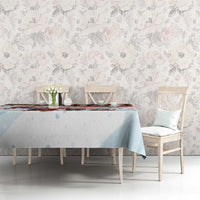 Christmas tablecloth on dining table, light blue drape with red-trim winter details