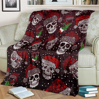Dark maroon skull blanket with green drink icons, white skull faces, and red confetti dots