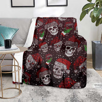 Dark maroon skull blanket with green cocktail motifs and white skull faces, spread on a rug