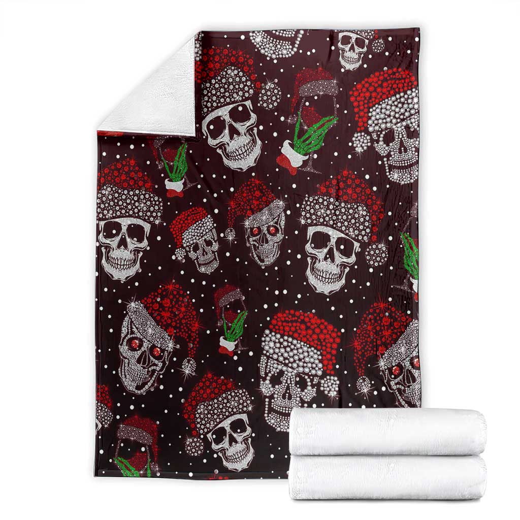 Folded dark maroon skull blanket with red speckles and green drink motifs