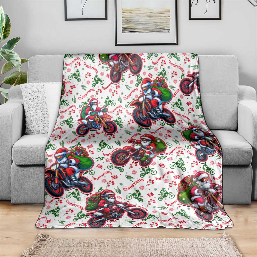 White Christmas blanket featuring Santa on motorbikes, draped across the seat