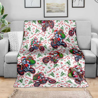 White Christmas blanket featuring Santa on motorbikes, draped across the seat