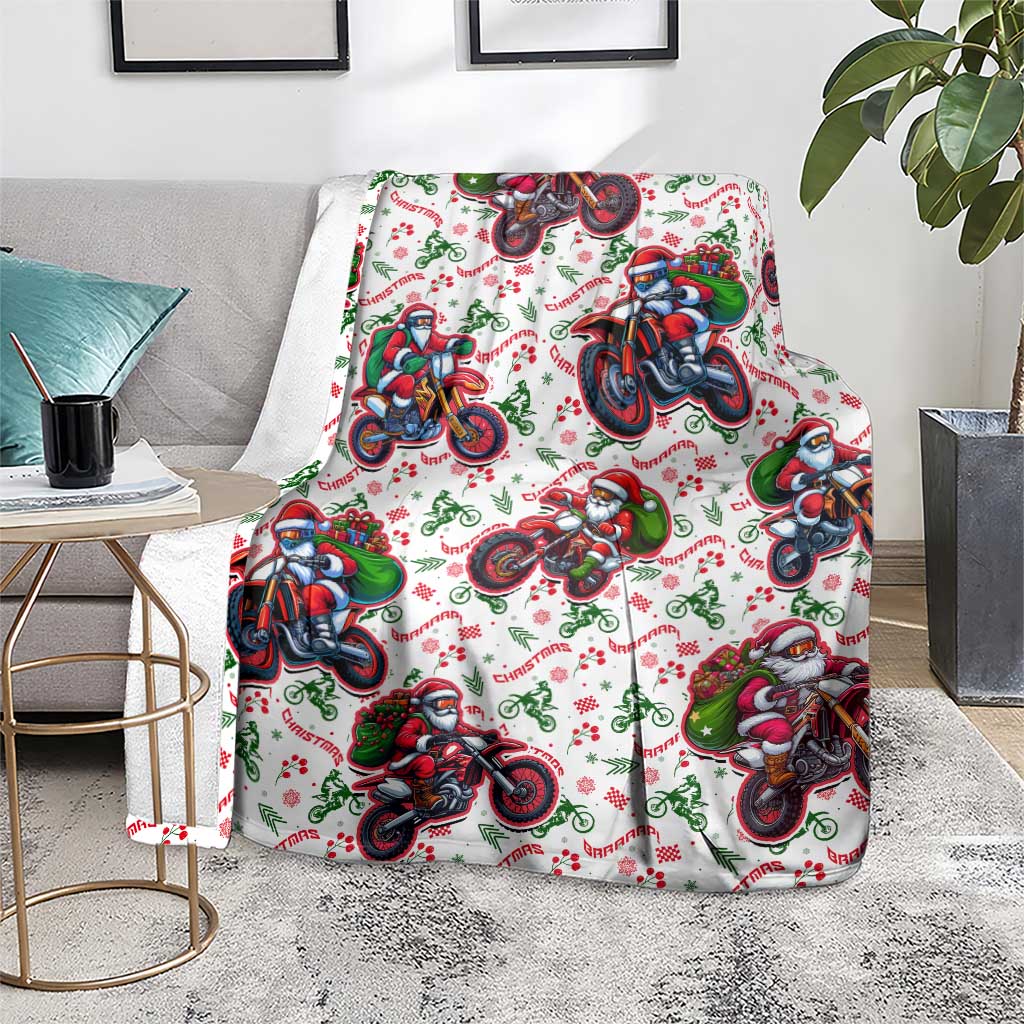 White Christmas blanket with Santa on motorbikes, draped over a sofa