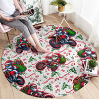 Round Christmas carpet featuring Santa motorbike riders across white background, red and green