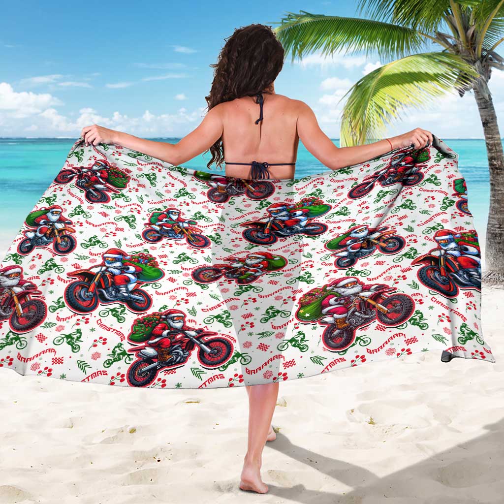 White beach sarong with repeating motorbike and Santa character graphic, tied waist