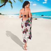 White sarong with motorbike and Santa character print, tied string detail
