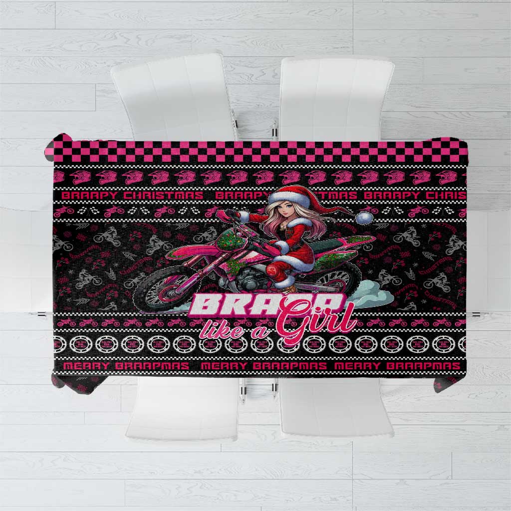 Black printed Christmas tablecloth with bike and girl themed graphic in pink and red.