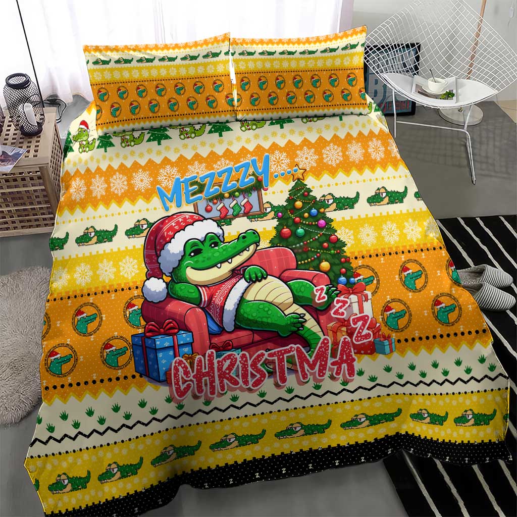 Yellow bedding set with cartoon crocodile in Santa hat on the duvet, two pillows