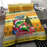 Yellow bedding set with cartoon crocodile in Santa hat on the duvet, two pillows