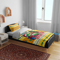 Yellow Christmas bedding set on a bed, duvet and pillows with cartoon crocodile artwork