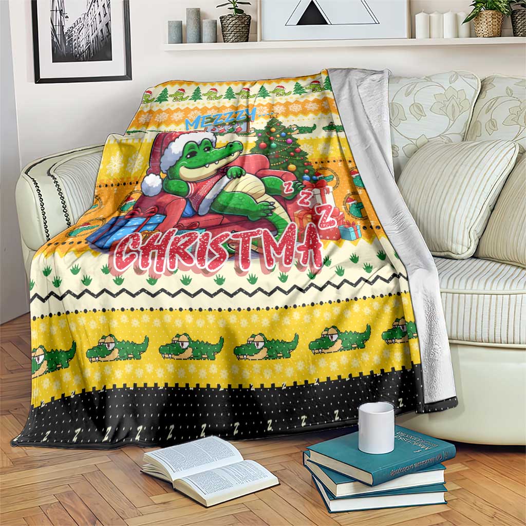 Yellow Christmas blanket with cute crocodile graphic, tree, gift, and lettering