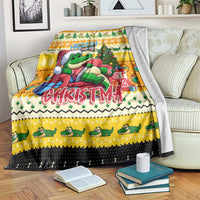Yellow Christmas blanket with cute crocodile graphic, tree, gift, and lettering