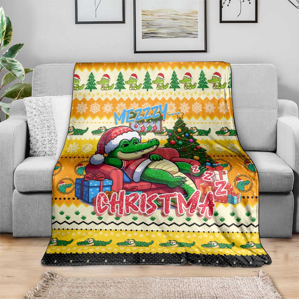 Yellow Mezzzy Christmas blanket draped over a sofa with crocodile and Christmas tree