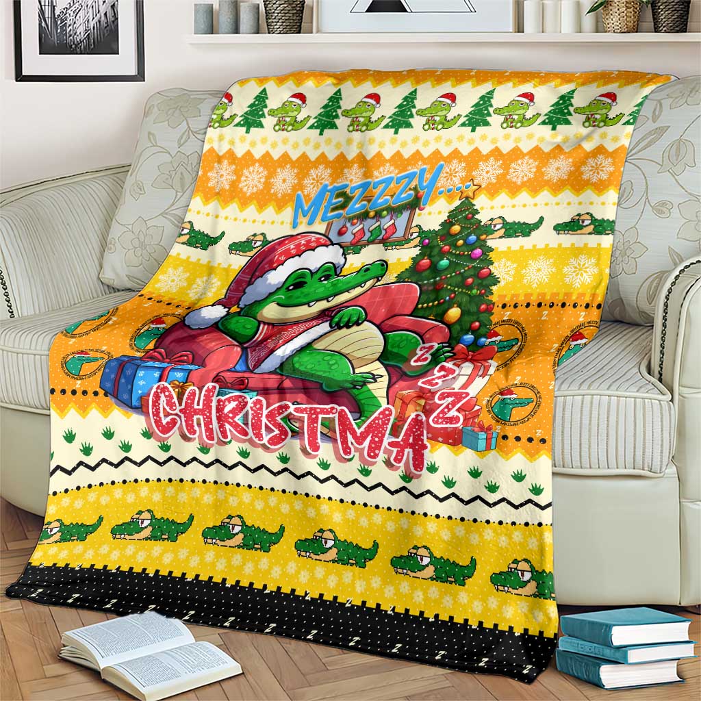 Yellow Christmas blanket featuring a crocodile holding a gift near a Christmas tree