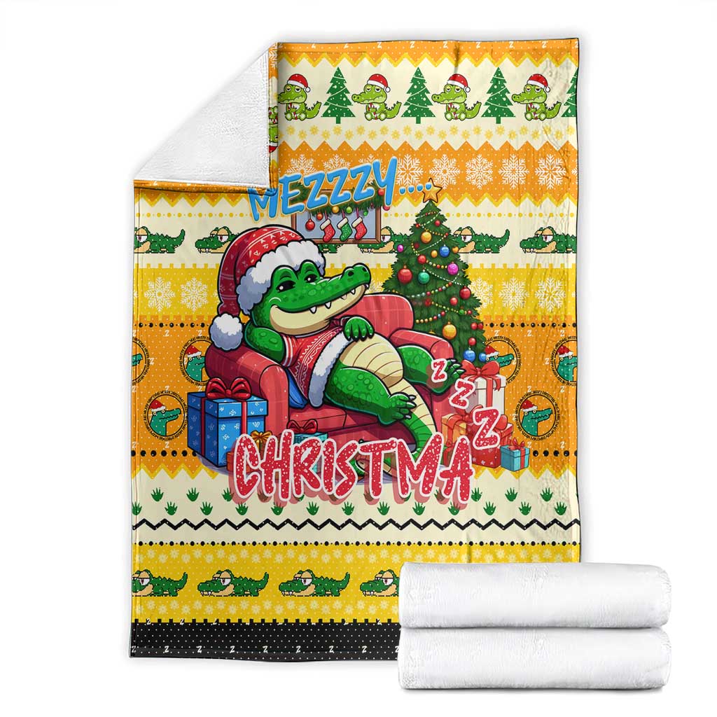 Yellow Christmas blanket product photo with crocodile, tree, gifts, and folded towels
