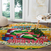 Yellow round Christmas rug featuring cartoon crocodile with gifts and 'CHRISTMAS' text