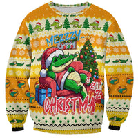 Yellow crewneck Christmas sweatshirt with crocodile in Santa hat and colorful front graphic.