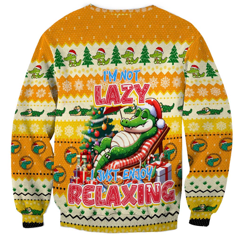 Yellow crewneck Christmas sweatshirt with crocodile relaxing scene and bold festive text.