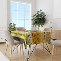 Yellow Christmas tablecloth with cartoon crocodile pattern on a dining table