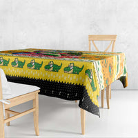 Yellow Christmas tablecloth corner view with crocodile and patterned border