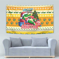 Yellow Christmas tapestry featuring cartoon alligator next to a decorated tree and 'CHRISTMA'