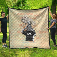Cream personalized quilt with diamond quilting, black trim, father-and-son scene artwork