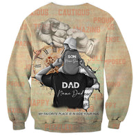 Tan crewneck sweatshirt back with father lifting son graphic, DAD and inside-your-hug text