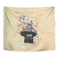 Gold-beige tapestry close-up: father and son hugging with black “DAD” emblem