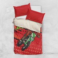 Red motocross Santa bedding set with duvet cover and red pillowcases over white base