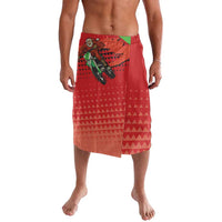Red patterned board shorts with Santa motocross graphic and green waistband accent