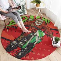 Round red area rug with motocross Santa illustration and green bike, circular rug