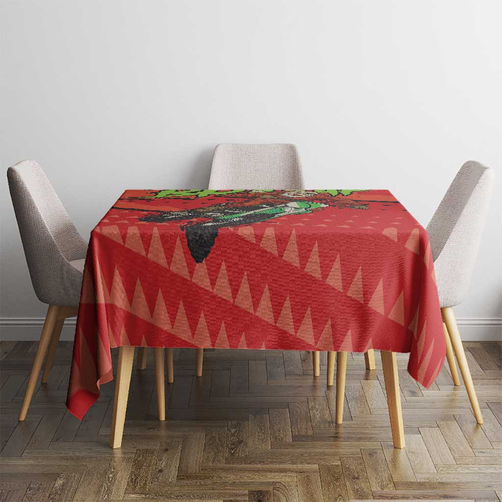 Red tablecloth featuring Santa on a motorcycle and geometric triangle design