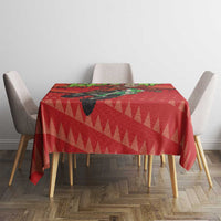 Red tablecloth featuring Santa on a motorcycle and geometric triangle design